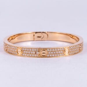 Gold bracelet with diamond embellishments.