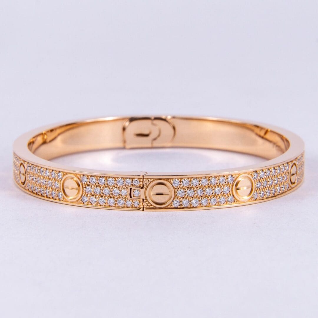 Gold bracelet with diamond embellishments.