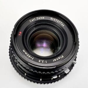 Camera lens with Carl Zeiss branding.