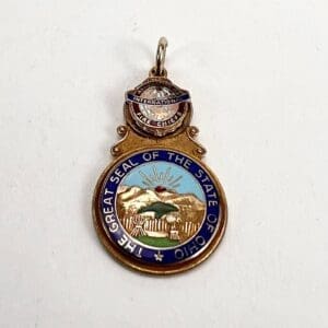 Ohio state seal pendant with fire chiefs emblem.