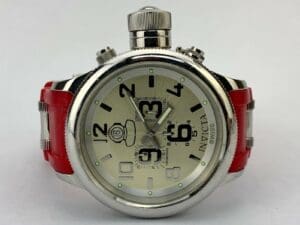 Silver watch with red strap, white background.