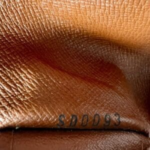 Brown textured leather with stamped code "SNO093".