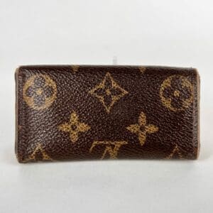 Brown designer wallet with monogram pattern.