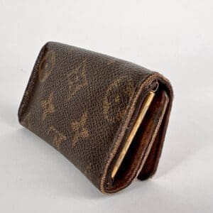 Brown patterned leather wallet on display.