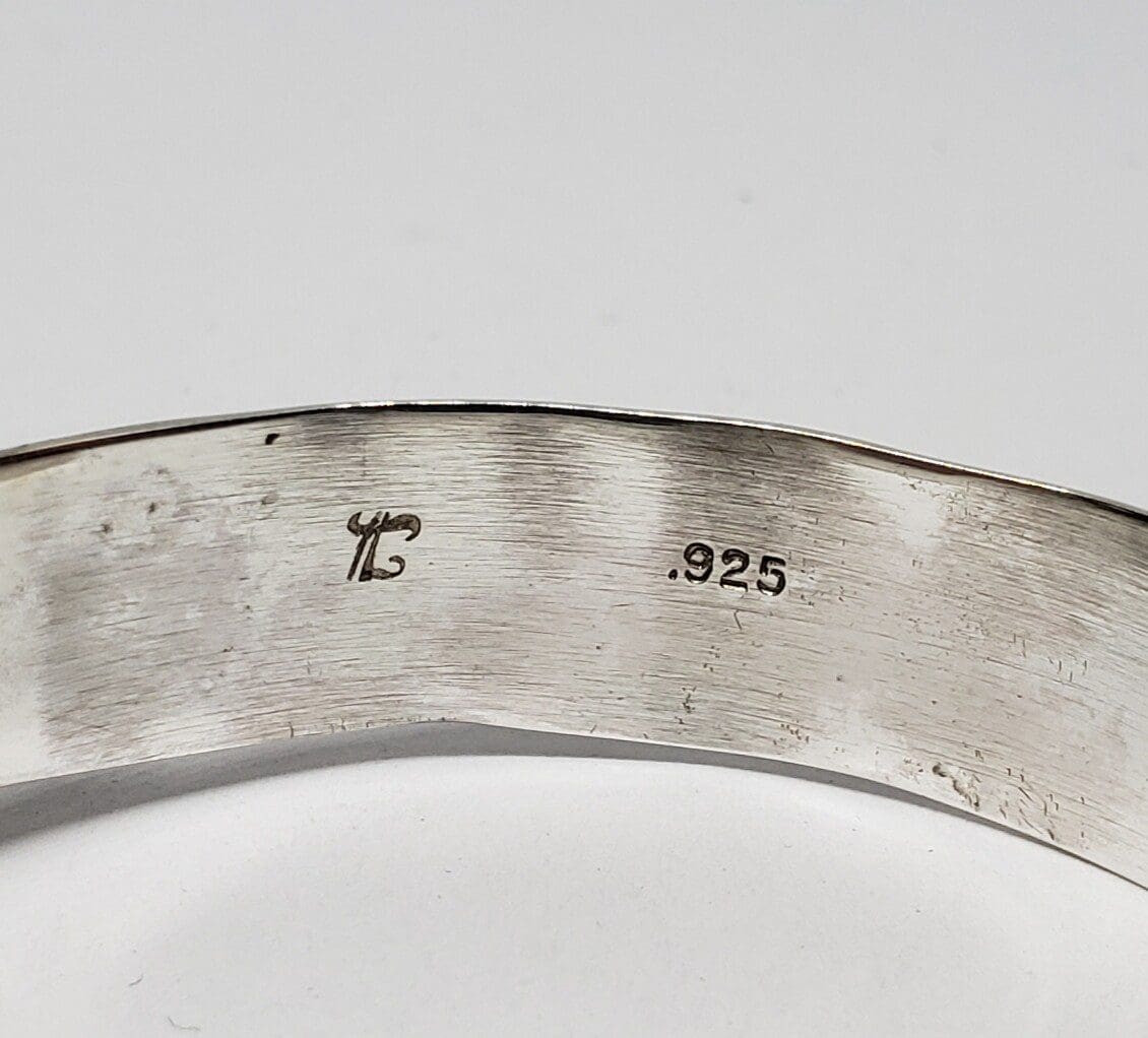 Silver ring with '.925' engraved marking.