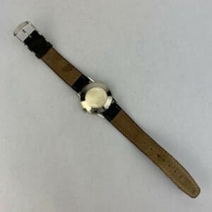 Wristwatch with brown leather strap.