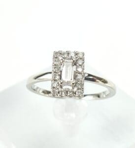 Diamond ring with rectangular center stone.
