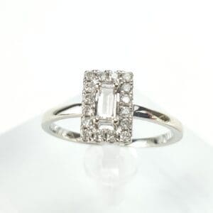 Diamond ring with rectangular center stone.