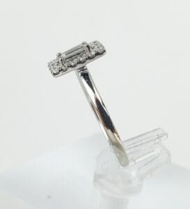 Silver ring with rectangular diamond setting.