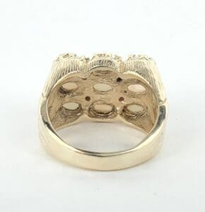 Gold ring with intricate design details.