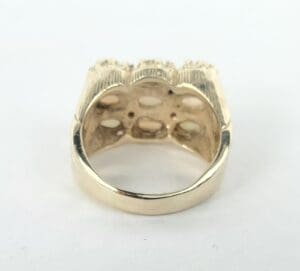 Gold ring with detailed design underside.