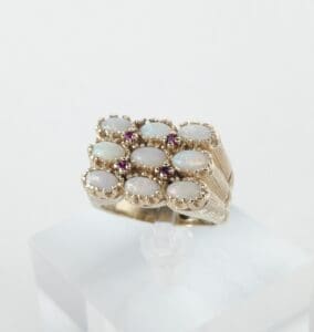 Gold ring with opal and ruby stones.