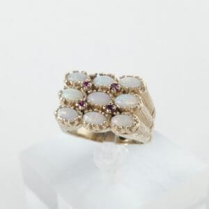 Gold ring with opal and ruby stones.