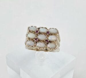 Gold ring with opals and small rubies.