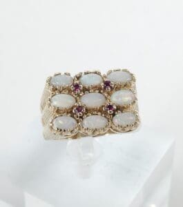 Gold ring with opals and small gems.