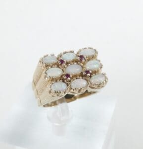 Gold ring with opal gemstones arrangement.