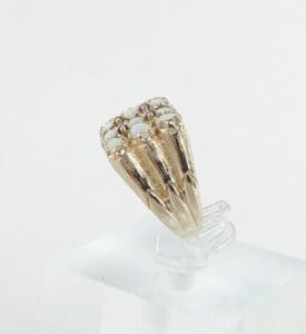 Gold ring with cluster of small stones.