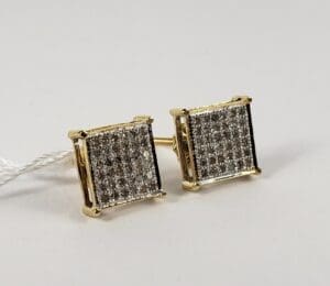 Square diamond stud earrings in gold setting.