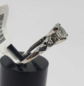 Diamond ring with intricate silver band design.