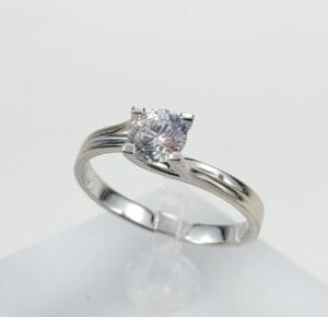 Silver ring with a single diamond.