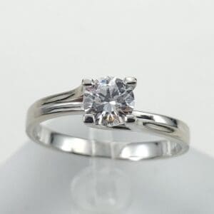 Silver engagement ring with a diamond gemstone.