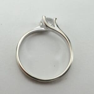 Silver ring with a marquise-cut diamond.