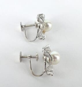 Silver clip-on earrings with pearls.