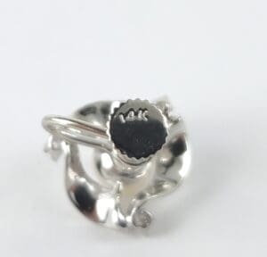 Silver earring backing stamped with "14K".