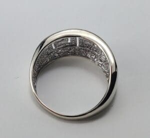 Silver ring with intricate interior design.