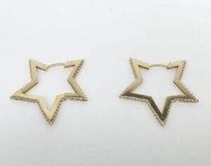 Gold star-shaped hoop earrings.
