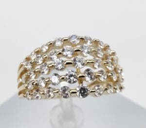 Gold ring with multiple diamond rows.