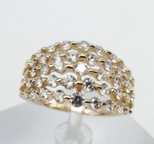 Gold ring with multiple diamond rows.