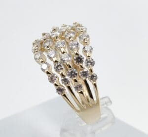 Gold ring with multiple diamonds design.
