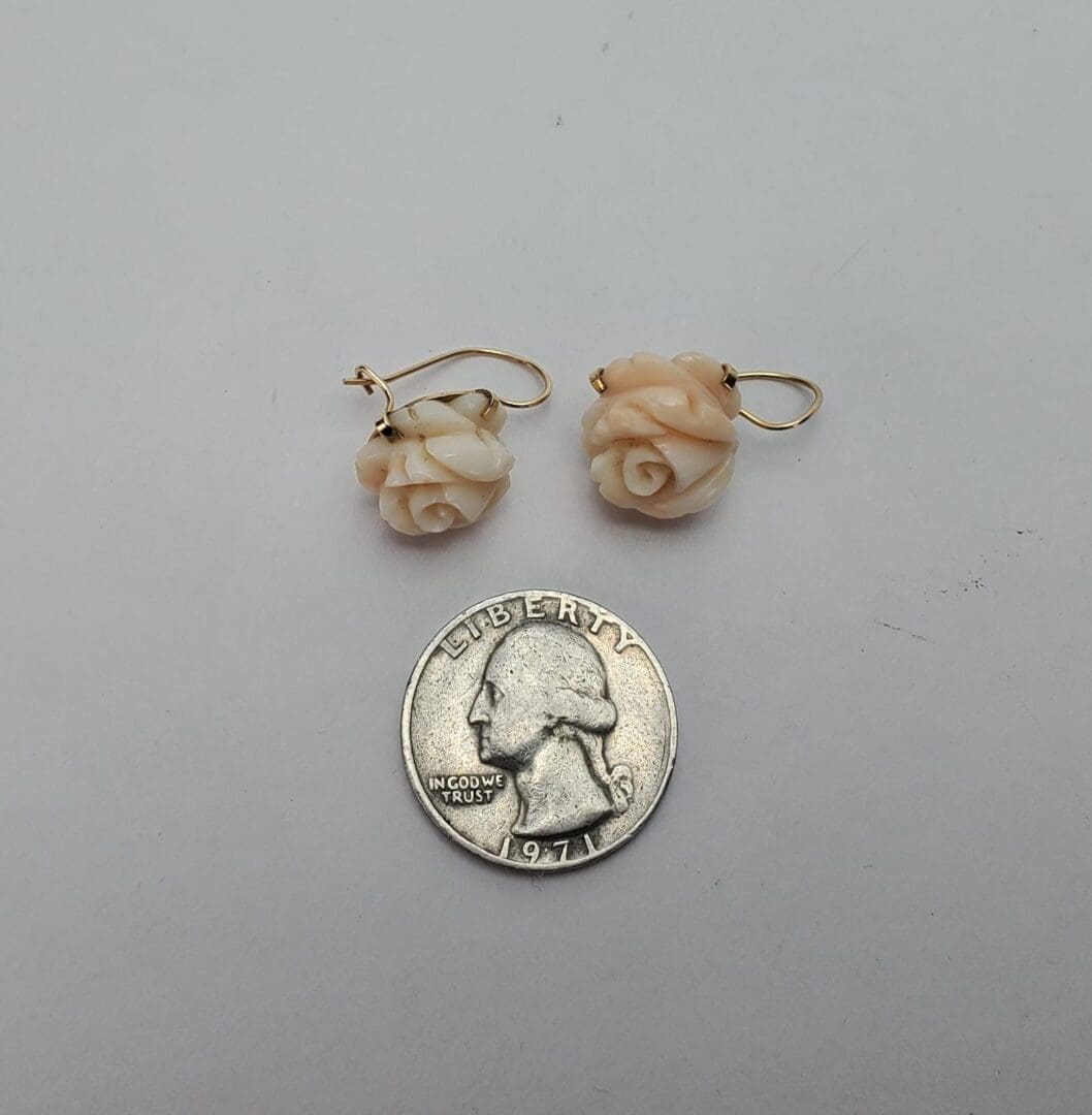 Rose earrings with a 1971 quarter.