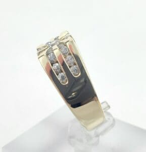Gold ring with diamond accents on display.