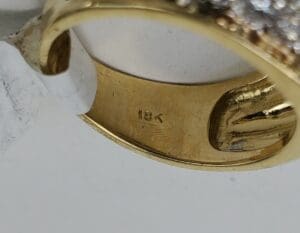 Gold ring with "18K" hallmark marking.