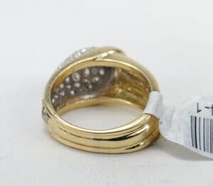 Gold ring with barcode tag attached.