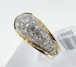 Gold ring with sparkling diamond cluster.