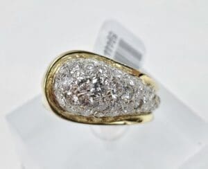 Gold ring with diamond cluster design.