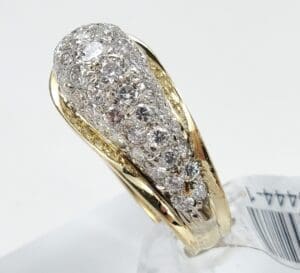 Gold ring with embedded diamonds, elegant design.