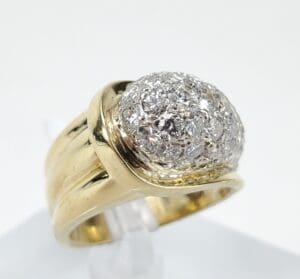 Gold ring with diamond cluster setting.