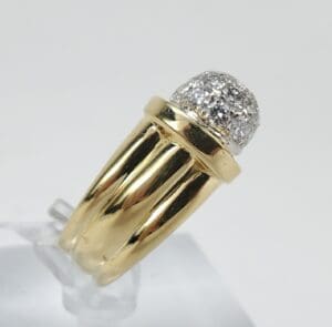 Gold ring with diamond cluster setting.
