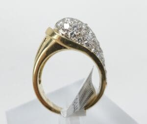 Gold ring with diamond cluster design.