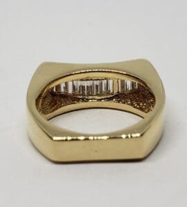 Gold ring with embedded vertical diamonds.