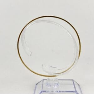 Golden spiral sculpture on clear base.