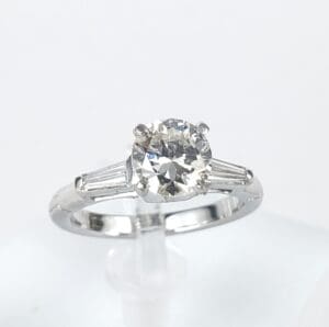 Diamond ring with baguette side stones.