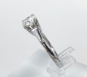 Silver ring with a single diamond setting.