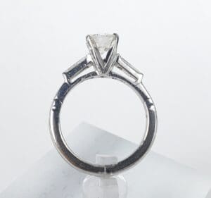 Silver ring with geometric diamond setting.