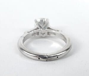 Silver engagement ring with solitaire diamond.