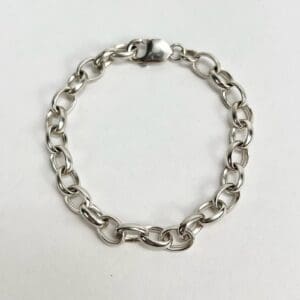 Silver chain bracelet on white background.